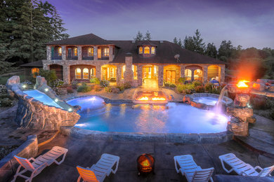 Inspiration for a huge mediterranean backyard stamped concrete and kidney-shaped natural water slide remodel in Portland