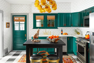 Transitional separate kitchen in Chicago with an undermount sink, recessed-panel cabinets, green cabinets, quartz benchtops, white splashback, subway tile splashback, stainless steel appliances, cement tiles, with island, multi-coloured floor and white benchtop.