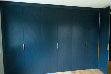 This is an example of a contemporary wardrobe in Kent.