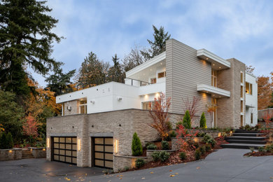 Inspiration for a contemporary white three-story house exterior remodel in Seattle with a shed roof