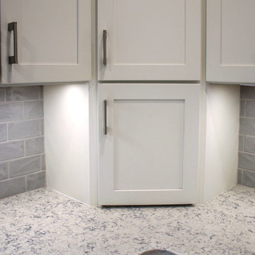 Two-Tone White & Blue Kitchen with Smoke Stained Quartz Countertops