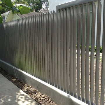 Verticle fence and Automatic gate and concrete retaining wall