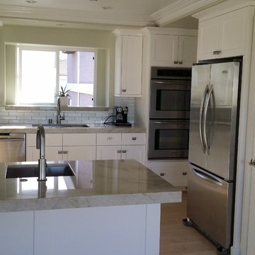Kitchen Renovation of cabinets with full overlay and counter tops.