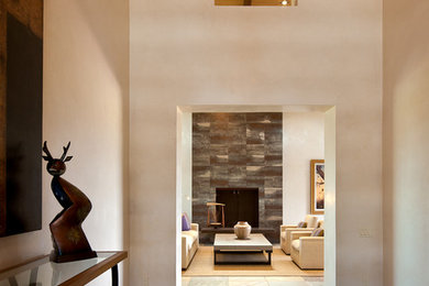 Foyer - mid-sized contemporary slate floor foyer idea in Albuquerque with beige walls