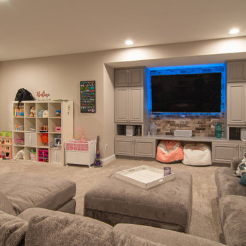 Basement With Entertainment Area for Family With Traditional Style Kitchenette