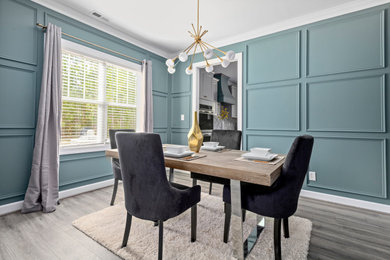 Mid-century modern dining room photo in Raleigh