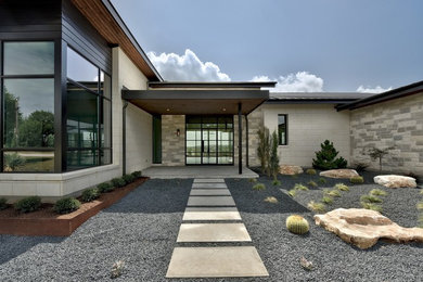 Entryway - huge transitional entryway idea in Austin with a black front door