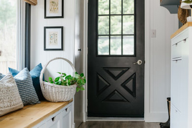 Inspiration for a small shiplap ceiling and wall paneling mudroom remodel in Toronto with white walls and a black front door
