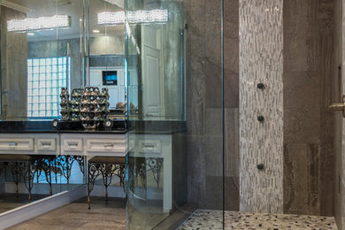 Inspiration for a modern master gray tile and glass sheet ceramic tile corner shower remodel in Houston with recessed-panel cabinets, white cabinets, gray walls and quartz countertops
