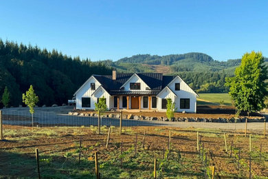 Example of a cottage exterior home design in Portland