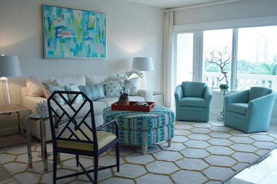Inspiration for a mid-sized beach style enclosed living room in Miami with grey walls, no tv and grey floor.