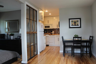 Small minimalist open concept light wood floor living room photo in Philadelphia with gray walls