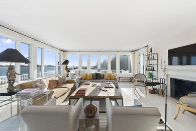 Family room - large contemporary enclosed porcelain tile and white floor family room idea in New York with white walls, a standard fireplace, a wood fireplace surround and a wall-mounted tv