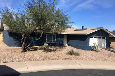 Mid-sized transitional blue one-story stucco exterior home photo in Phoenix with a shingle roof