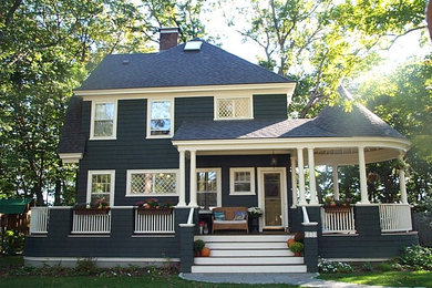 Mid-sized traditional blue two-story wood exterior home idea in Boston with a hip roof