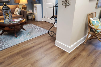 Home studio - large modern vinyl floor and brown floor home studio idea in Charlotte with beige walls