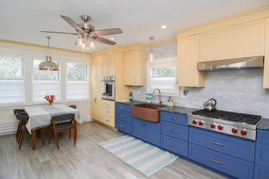 Eat-in kitchen - mid-sized transitional ceramic tile and gray floor eat-in kitchen idea in Boston with a farmhouse sink, beaded inset cabinets, blue cabinets, soapstone countertops, gray backsplash, marble backsplash, stainless steel appliances, no island and gray countertops