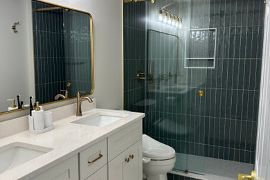 Example of a mid-sized trendy master green tile and subway tile porcelain tile, gray floor and double-sink sliding shower door design in Atlanta with shaker cabinets, white cabinets, a bidet, white walls, granite countertops, white countertops, a niche and a built-in vanity