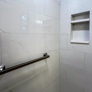 Timeless White Vanity Paired with Luxury Tiled Shower