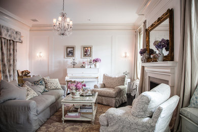 Mid-sized cottage chic enclosed living room photo in Los Angeles with white walls