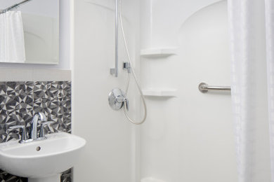 Contemporary bathroom in San Francisco with an alcove shower, a two-piece toilet, black and white tile, white walls, a wall-mount sink and a shower curtain.