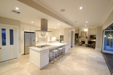 Photo of a contemporary kitchen in Perth with flat-panel cabinets, white cabinets and with island.