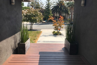 Mid-sized trendy front porch idea in San Francisco with decking and a roof extension