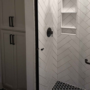 Guest shower herringbone tile