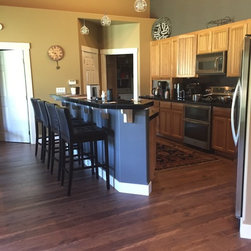 Open concept Kitchen & Bar - Laminate Flooring