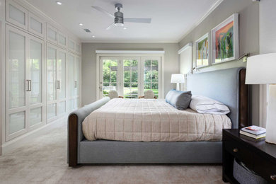 Example of a large minimalist master carpeted and beige floor bedroom design in Dallas with gray walls