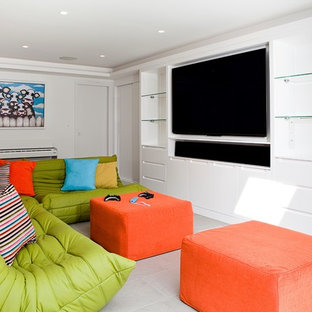 This is an example of a large contemporary enclosed home cinema in London with white walls, ceramic flooring and a built-in media unit.