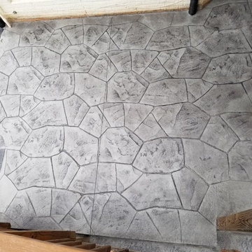 C-Stamped concrete patio with a wall