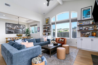 Living room - mid-century modern vinyl floor living room idea in Santa Barbara with white walls and a wall-mounted tv