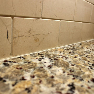 Beige Kitchen with Extra Large Island, Tile Backsplash and Granite Countertops