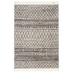 Jaipur Living - Vibe by Jaipur Living Kula Trellis Black and Blue Area Rug, 8'x10' - The Bahia collection lends a global vibe to any space with a modern twist on classic Moroccan motifs. The Kula rug features a classic trellis motif in an updated colorway of black, blue, gray, brown, and ivory. Soft to the touch, this medium plush rug emulates the inviting and worldly style of authentic flokati rugs, but in a durable polypropylene power-loomed quality. Braided fringe accents further the boho-chic appeal of this unique rug.