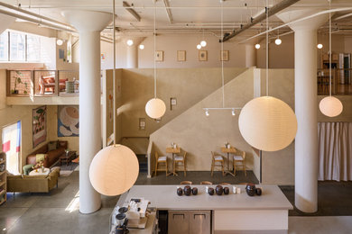 Inspiration for a huge modern concrete floor and gray floor great room remodel in San Francisco with beige walls