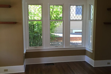 Large elegant enclosed dark wood floor family room photo in Seattle