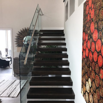 Floating iron stair with glass railings