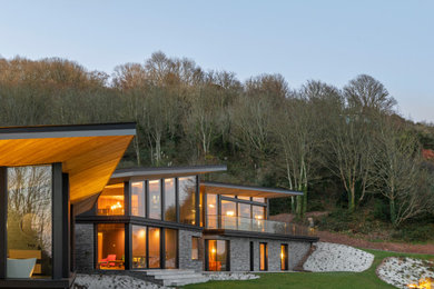 Inspiration for a large contemporary house exterior in Devon.