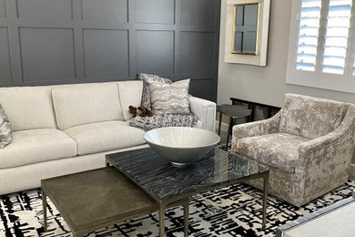 Example of a mid-sized minimalist enclosed ceramic tile, multicolored floor and wall paneling living room design in Phoenix with beige walls and a tv stand