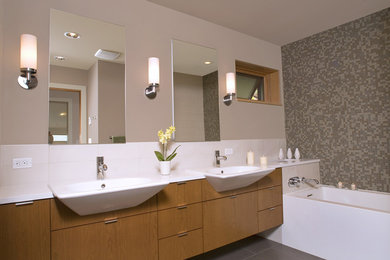 Photo of a contemporary bathroom in Seattle with mosaic tile.