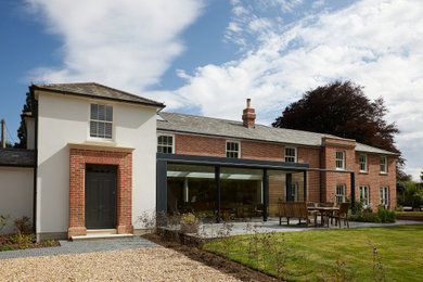 Photo of a traditional home design in Hampshire.
