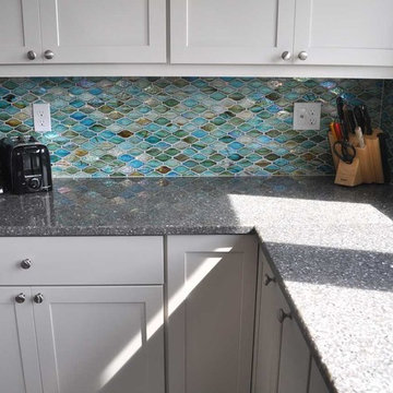 Kitchen Remodel in the Waves. Custom tiles made to resemble a wavelike pattern.