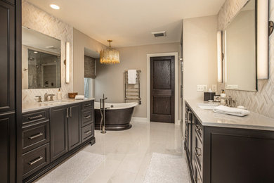 Inspiration for a transitional gray tile and mosaic tile gray floor and double-sink freestanding bathtub remodel in Milwaukee with recessed-panel cabinets, black cabinets, beige walls, an undermount sink, gray countertops and a built-in vanity