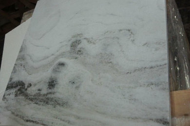 CALCATTA SWIRLING GREY BEIGE VEIN on WHITE BASE