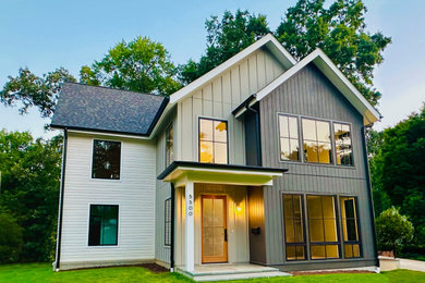 Mid-sized contemporary multicolored two-story mixed siding and board and batten exterior home idea in DC Metro with a shingle roof and a brown roof