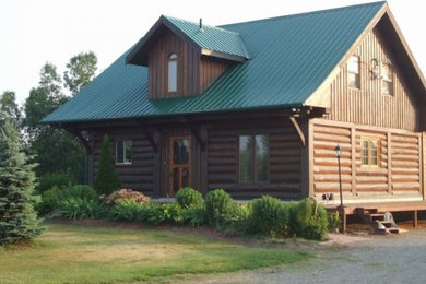 Example of a mid-sized classic one-story wood house exterior design in Toronto