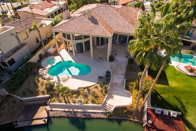 Example of a southwest home design design in Phoenix