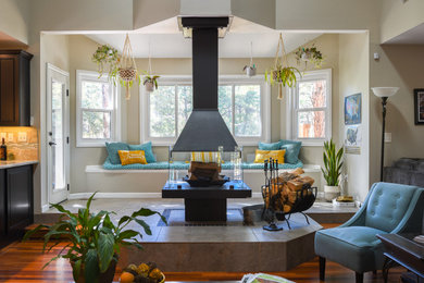 Example of a transitional living room design in Denver