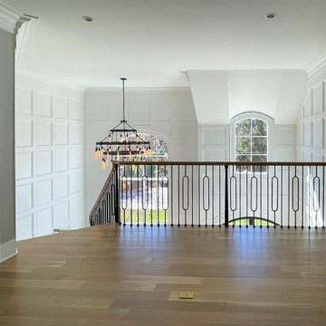Project #95 | Freestanding Elliptical Staircase with Geometric Iron Balusters